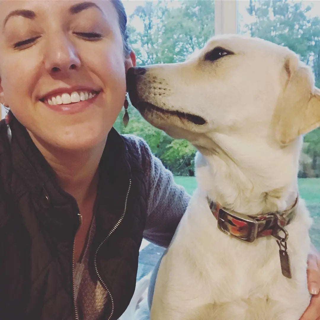 dog kissing woman, beautiful dog, dog shampoo, harvest hills skin care