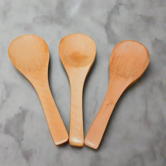 three small wooden spoons