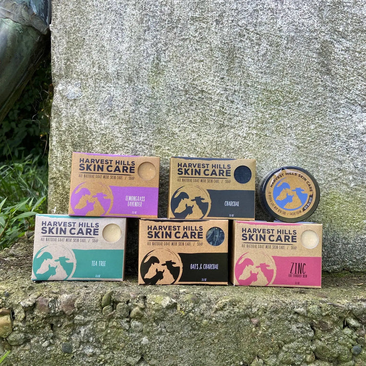 five bars of goat milk soap that are helpful for oily skin and acne. One jar of natural face cream