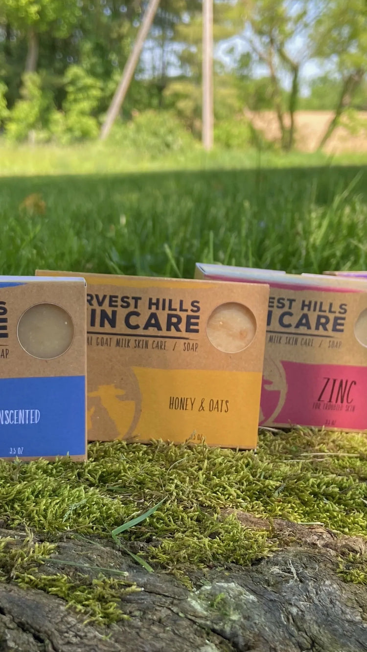 Unscented, honey and oats, zinc and lavender goat milk soap for eczema sitting on moss-Harvest Hill Skin Care