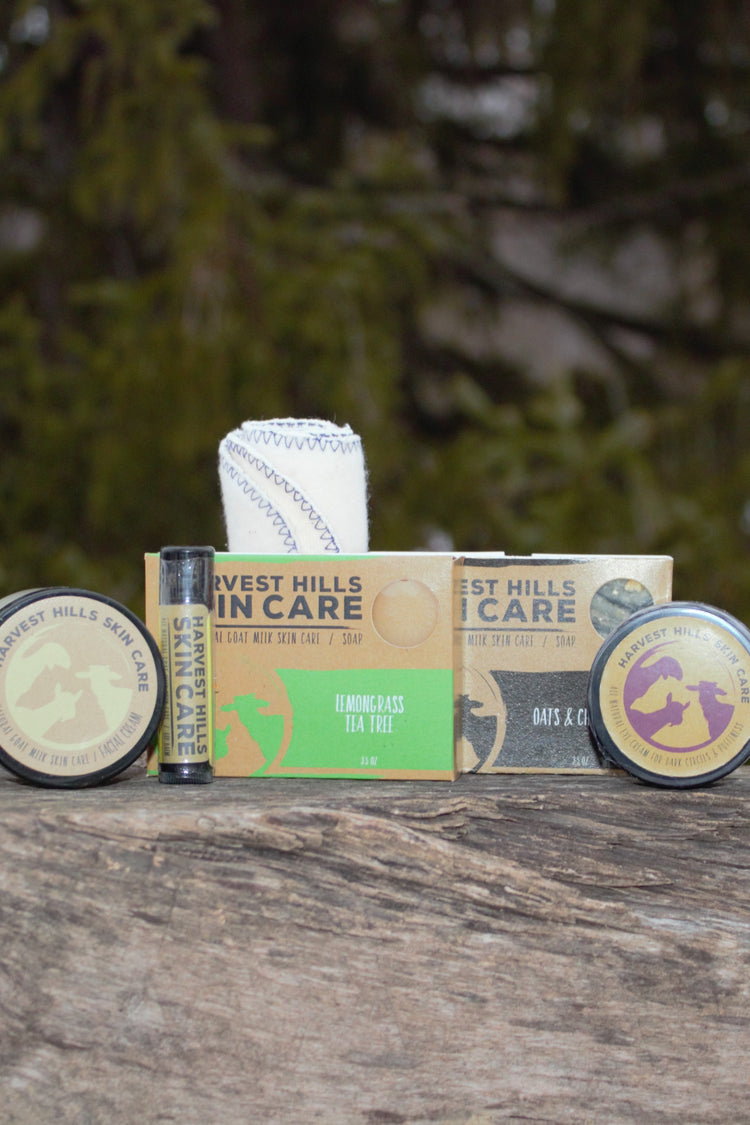 Harvest Hills goat milk face cream, 2 bars of goat milk soap, 1 natural lip balm, one organic cotton cloth, one all natural eye cream