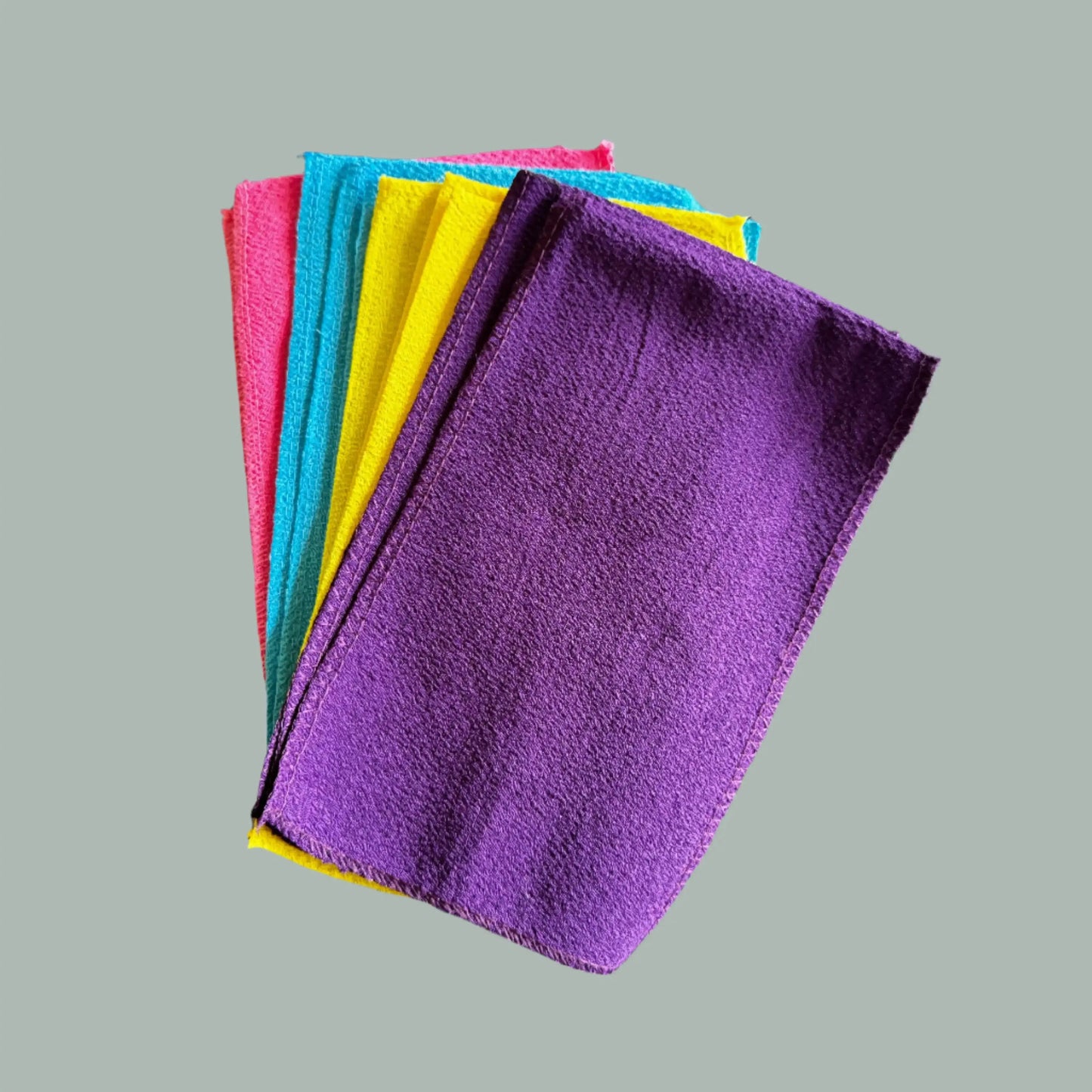 pink, yellow, blue and purple scrub cloths
