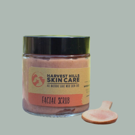 Jar of Harvest Hills Skin Care Facial Scrub with a wooden spoon 