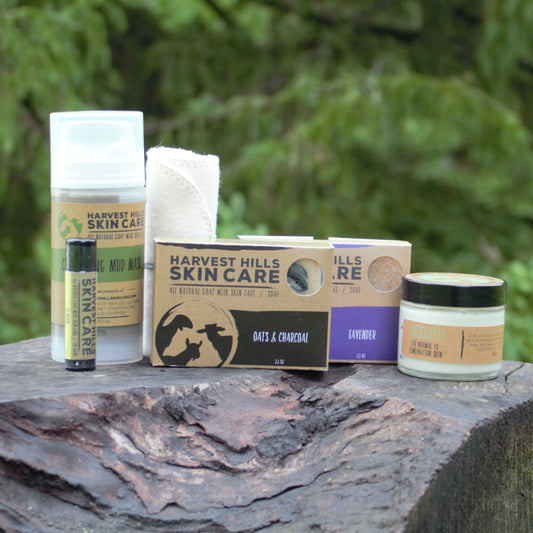 A set of Harvest Hills Skin Care for combination face skin.  Includes lip balm, clarifying mud mask, 2 bars of goat milk soap, a jar of unscented goat milk face cream, organic cotton face cloth