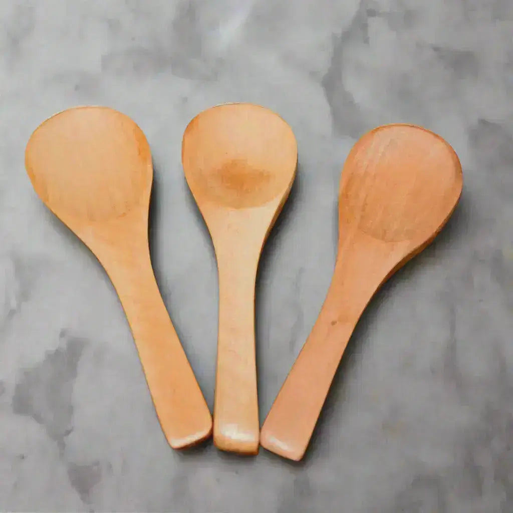 three small wooden spoons