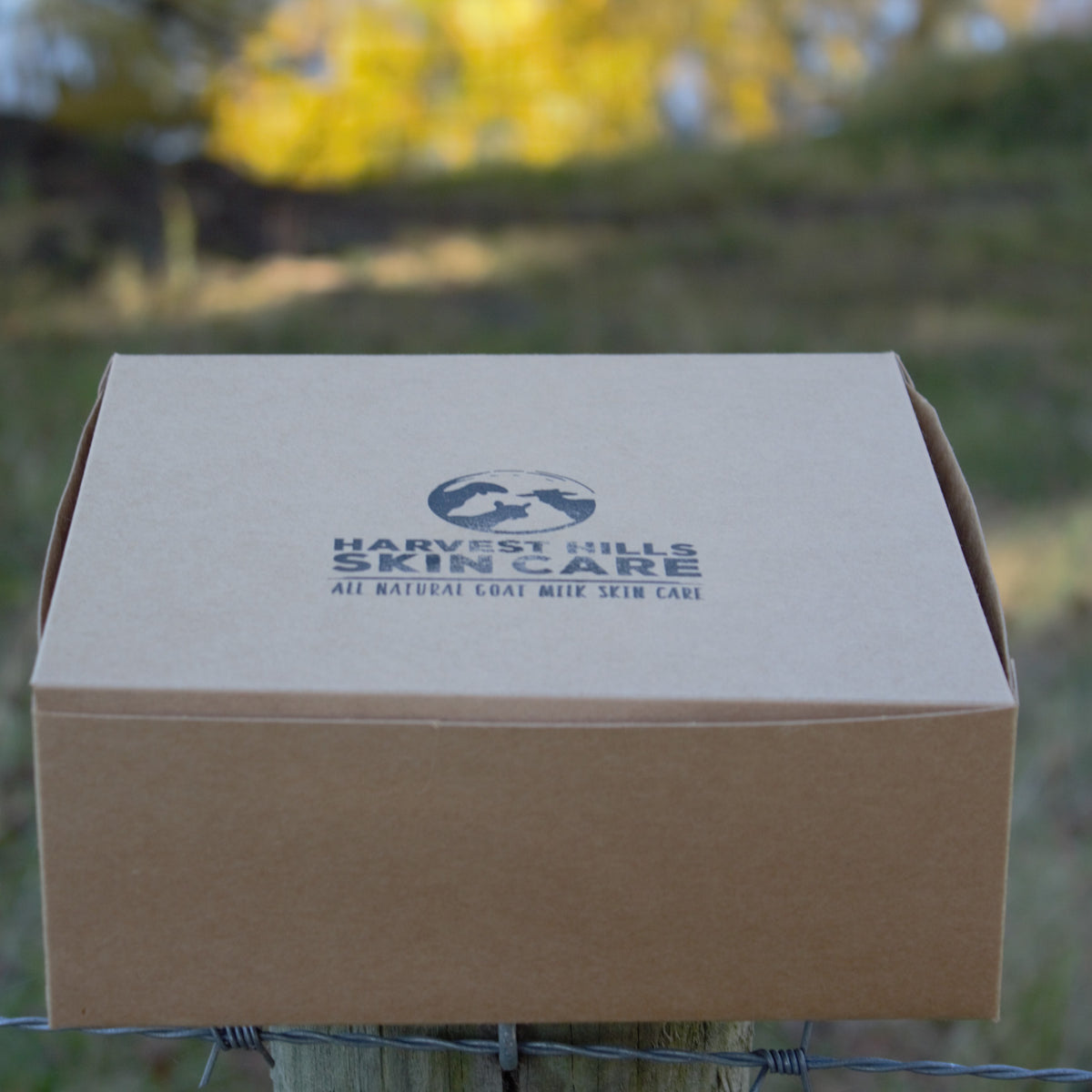 kraft paper box with harvest hills skin care logo on lid